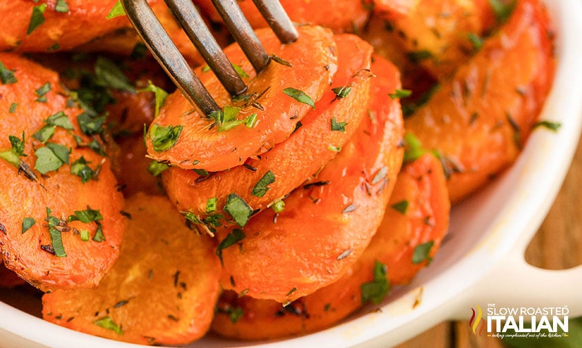 closeup of brown sugar roasted carrots on a fork