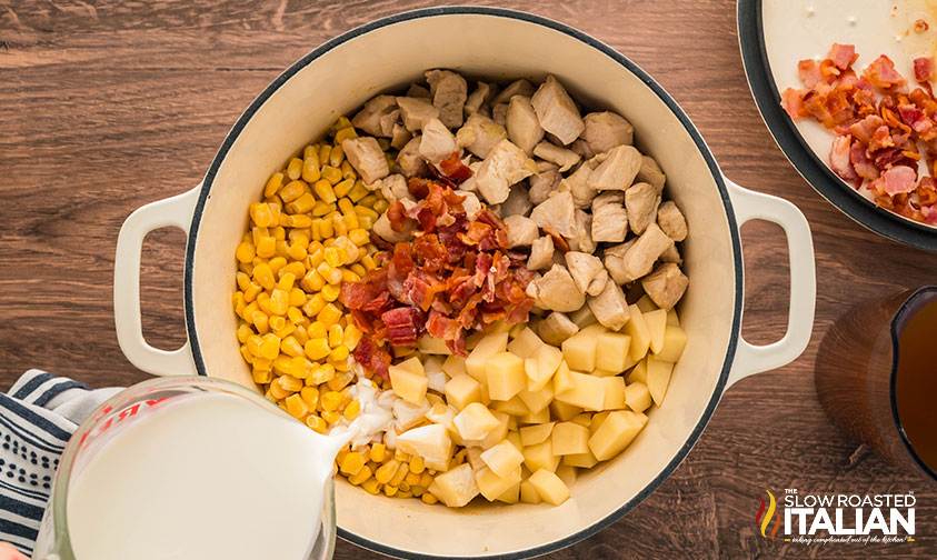 adding half and half to pot of chicken bacon corn chowder