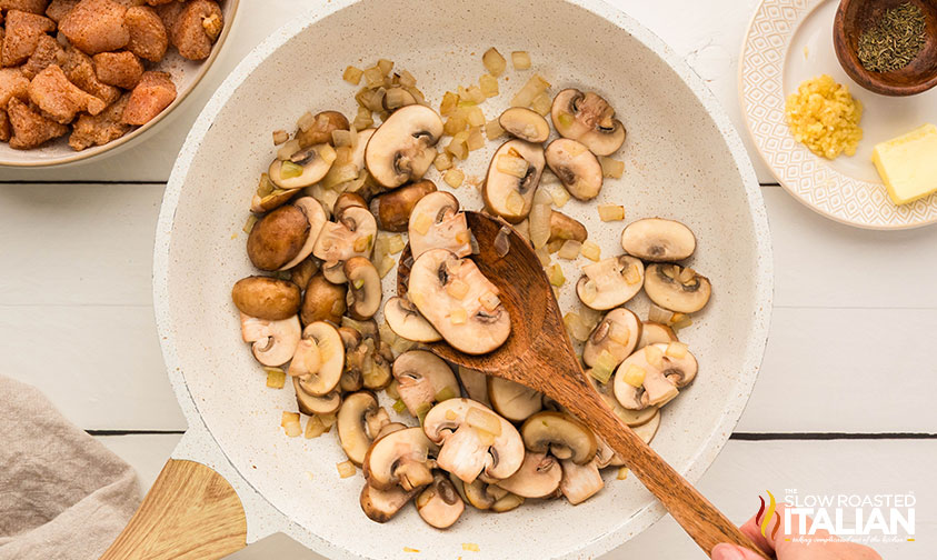 cooking mushrooms and garlic for chicken stroganoff