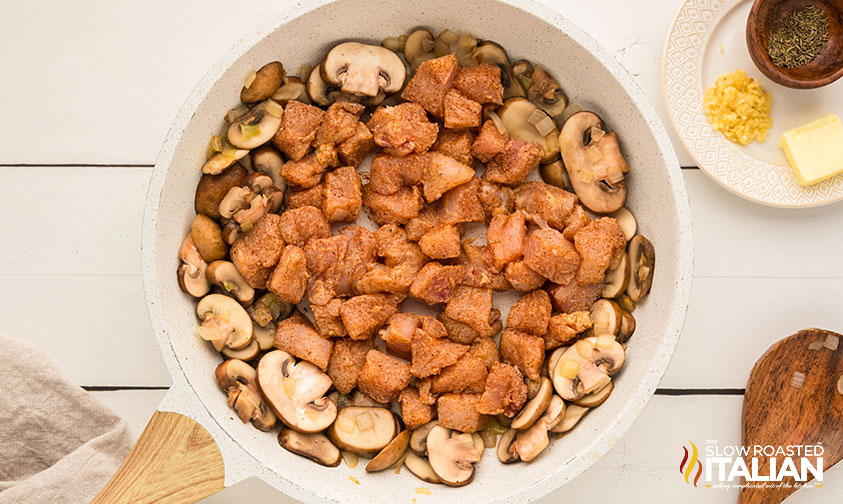 adding cooked chicken to stroganoff