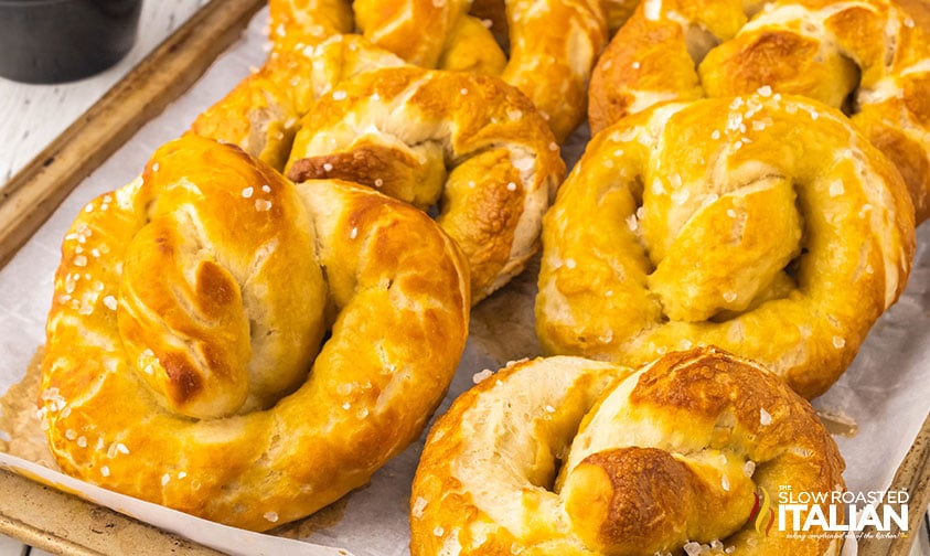 soft baked pretzels on a baking sheet