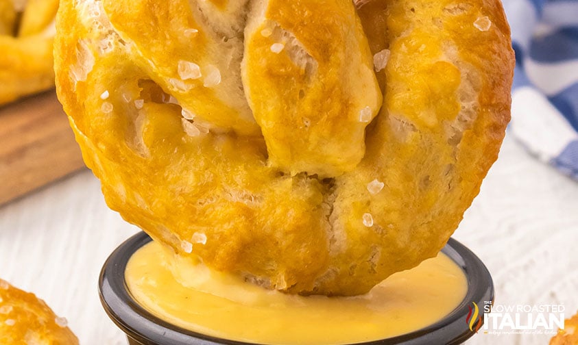 baked soft pretzels dipped in cheese sauce