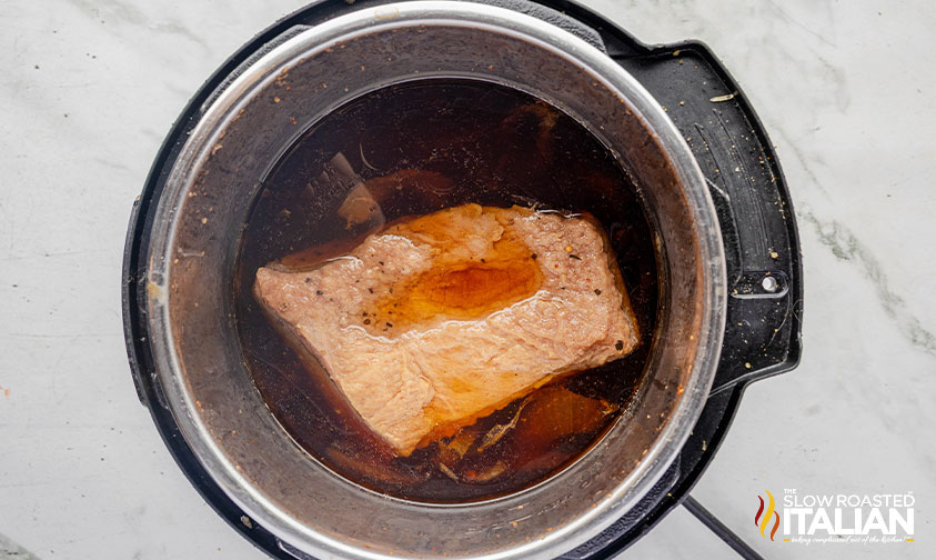 corned beef, beef stock and onions added to instant pot