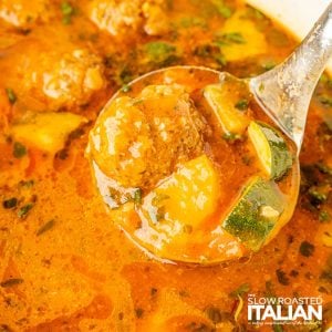 closeup of albondigas soup in a ladle