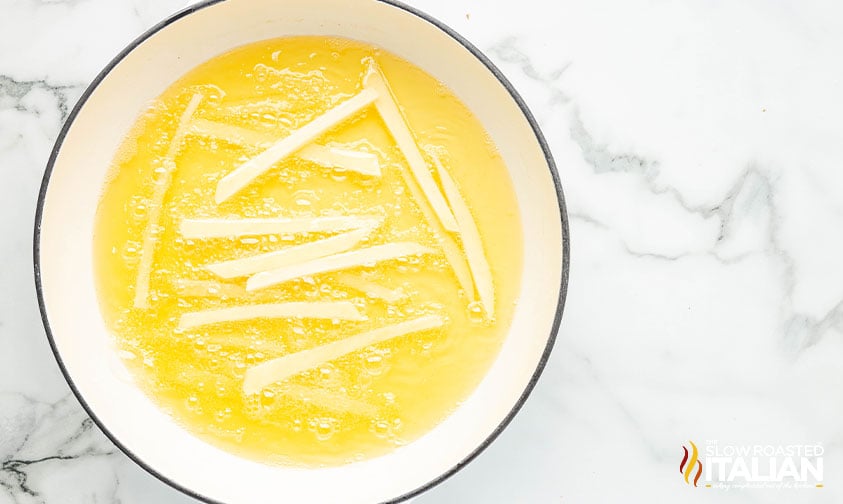 frying beef tallow french fries in a large pot