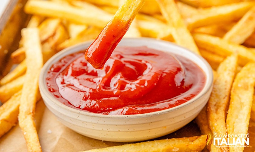 beef tallow french fries dipped in ketchup