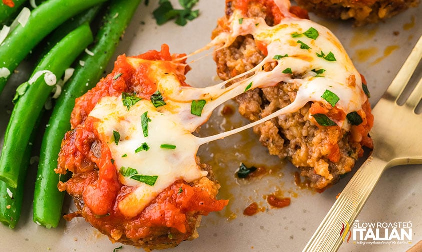 closeup of meatloaf cups with ooey gooey cheese