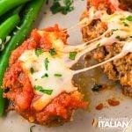 closeup of cheesy meat loaf cups with ooey gooey cheese