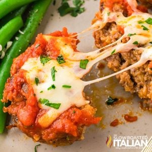 closeup of cheesy meat loaf cups with ooey gooey cheese