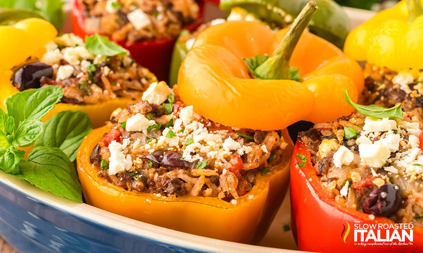 greek stuffed peppers in a baking dish