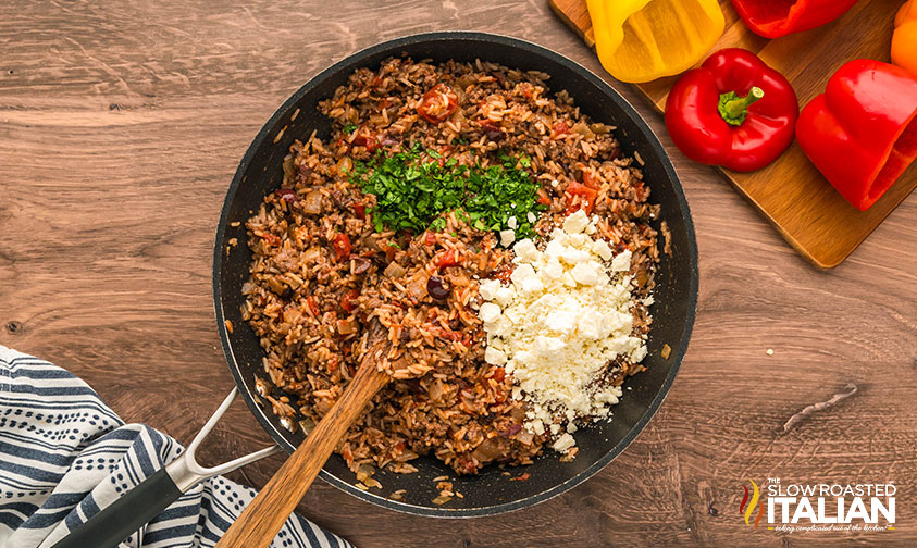 greek stuffed peppers mixture in a skillet