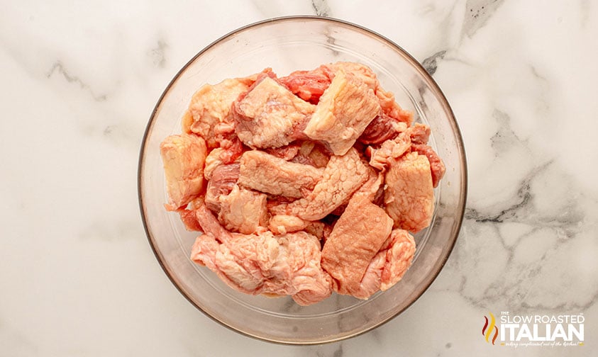 trimmed fat for making beef tallow in a glass bowl