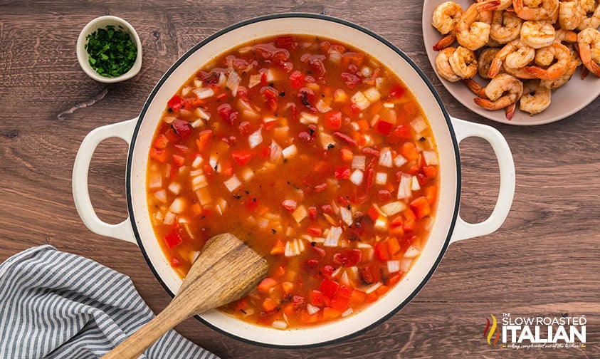 cajun shrimp and rice simmering in a large pot