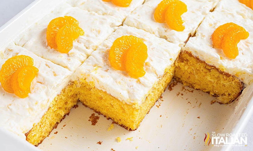 sliced pig pickin cake in a white baking dish