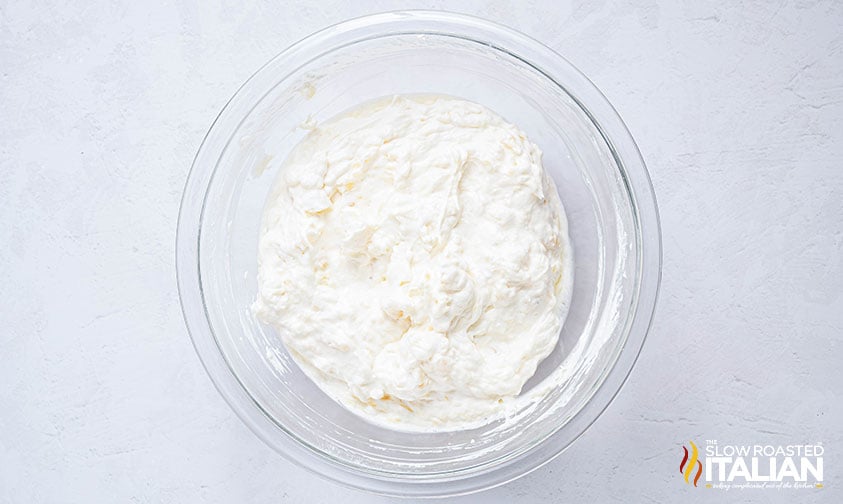 mixed pig picking cake topping in a glass mixing bowl