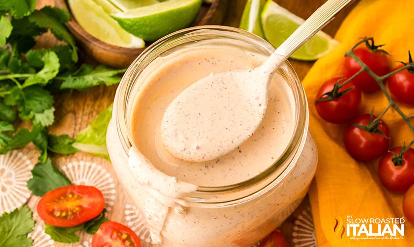 spoon full of southwest chopped salad over a glass jar