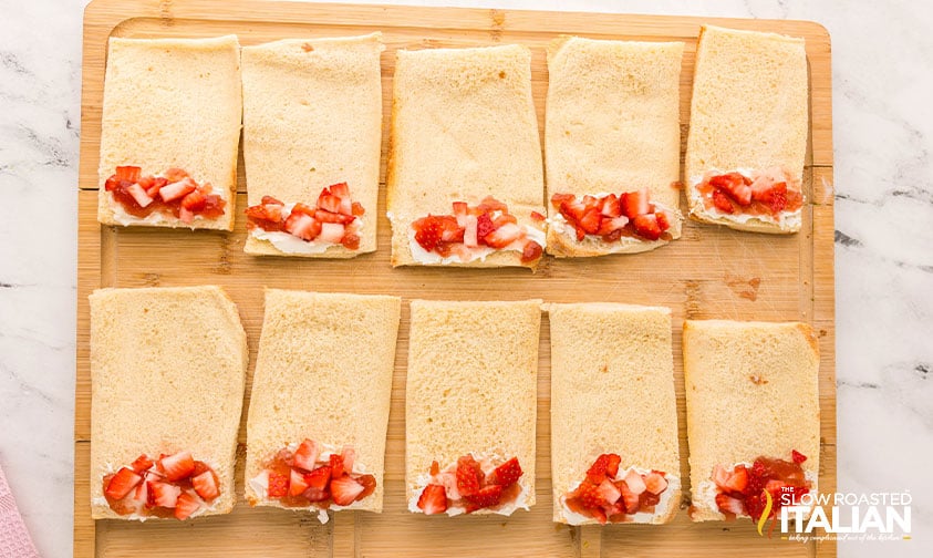 filling french toast rollups with diced strawberries