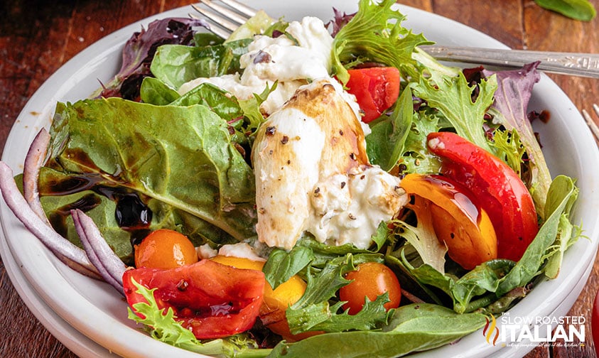 burrata caprese salad with fresh tomatoes, basil, and olive oil