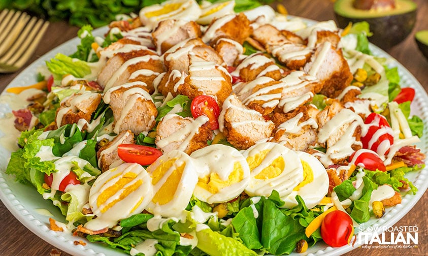 chicken cobb salad with eggs, cheese, bacon, and fresh greens