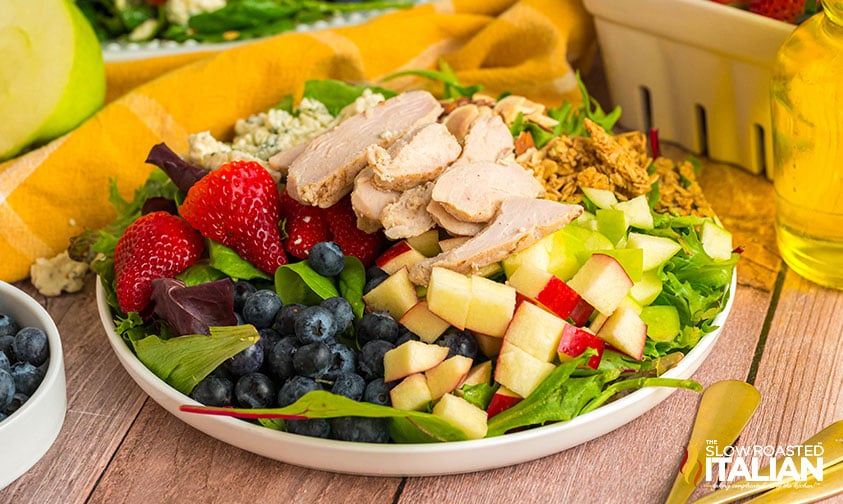 chicken market salad with fresh fruit, greens, and light dressing