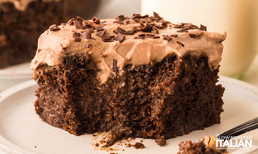 slice of chocolate tres leches cake on a white plate
