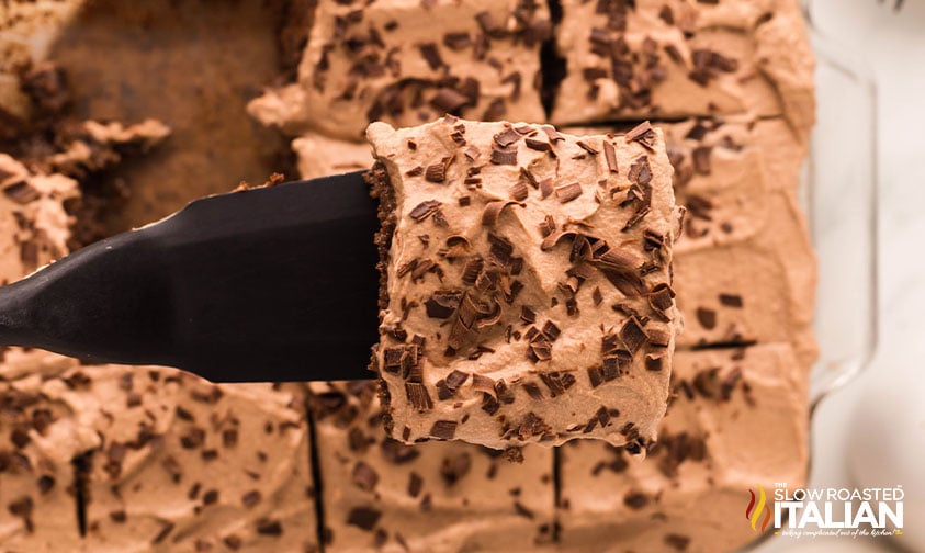 slice of chocolate tres leches cake on a spatula