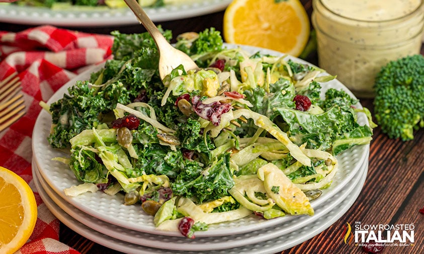 sweet kale salad with crunchy toppings and creamy poppy seed dressing