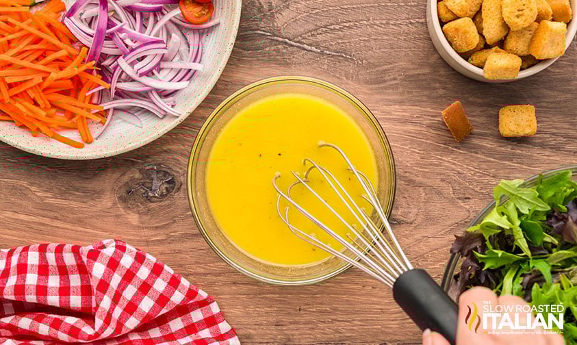 whisking dressing for mixed green salad