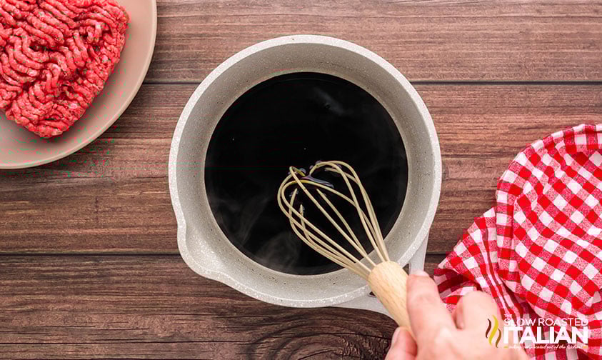 whisking balsamic reduction for pesto burger