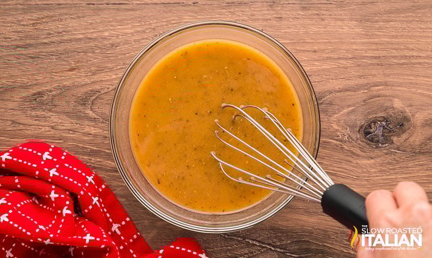 whisking italian vinaigrette for italian chopped salad