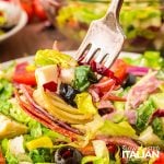 Italian chopped salad on a fork
