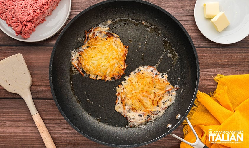 frying fresh shredded hashbrowns in a skillet to put on breakfast burger