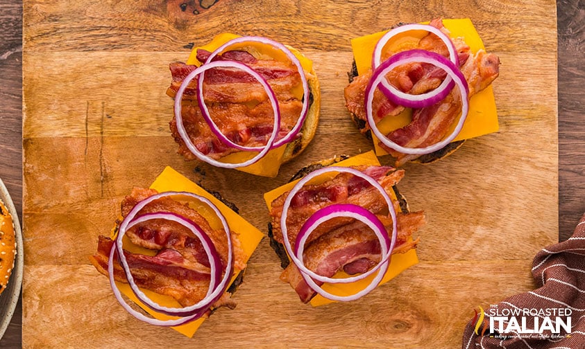adding toppings to bbq bacon burger
