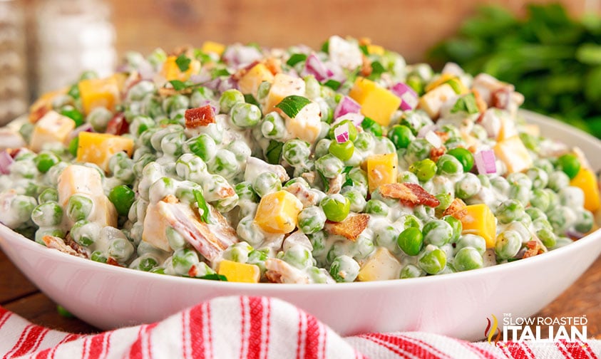 creamy pea salad with bacon, cheese, and simple dressing