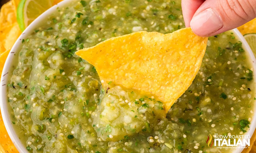tortilla dipped in roasted salsa verde