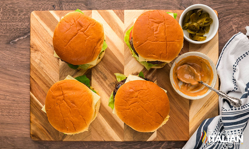 jalapeno burgers on a wooden board