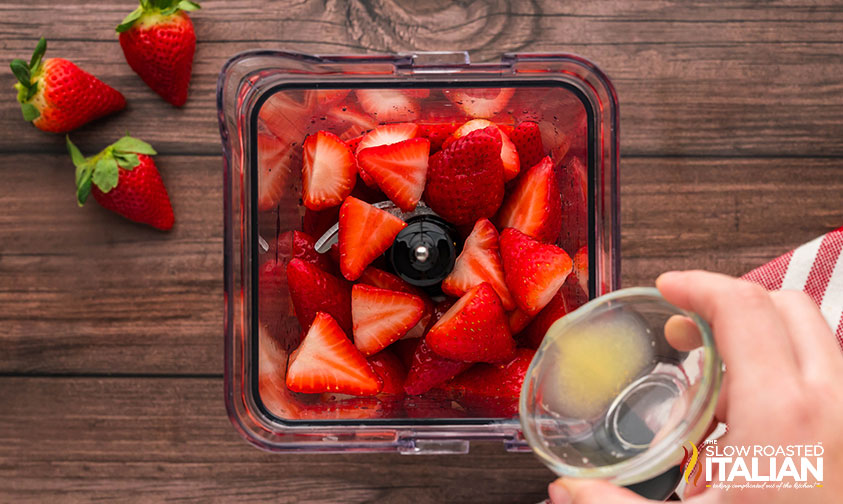adding Strawberry Popsicles ingredients to the blender