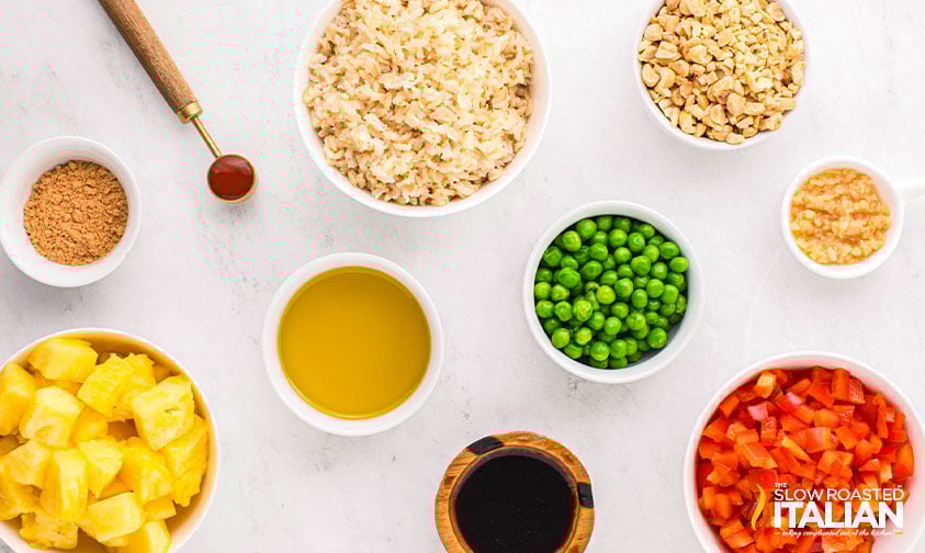measured ingredients in small bowls to make thai pineapple fried rice recipe