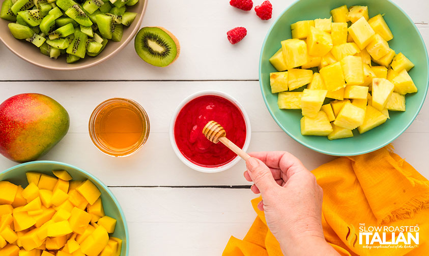 pureed raspberries in a small bowl for tropical popsicles