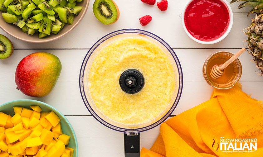 pureed pineapple chunks in a food processor