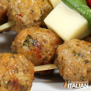 closeup of cheesy sun dried tomato meatball poppers