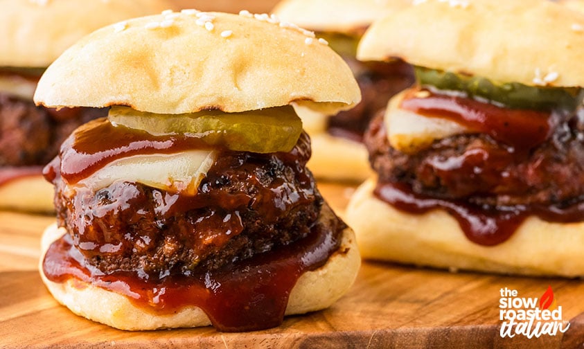closeup of bbq sliders dripping with sauce