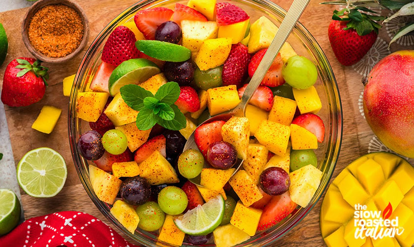 mixed mexican fruit salad with a spoon