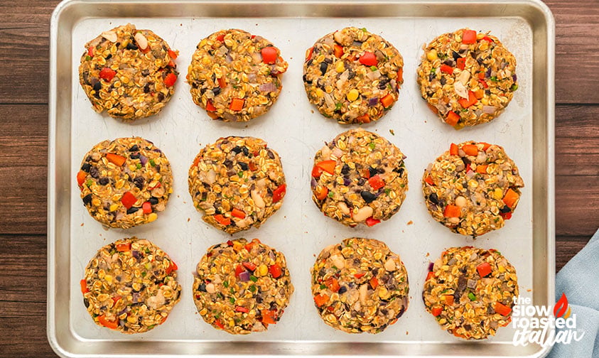 shaped homemade veggie burgers on a baking sheet