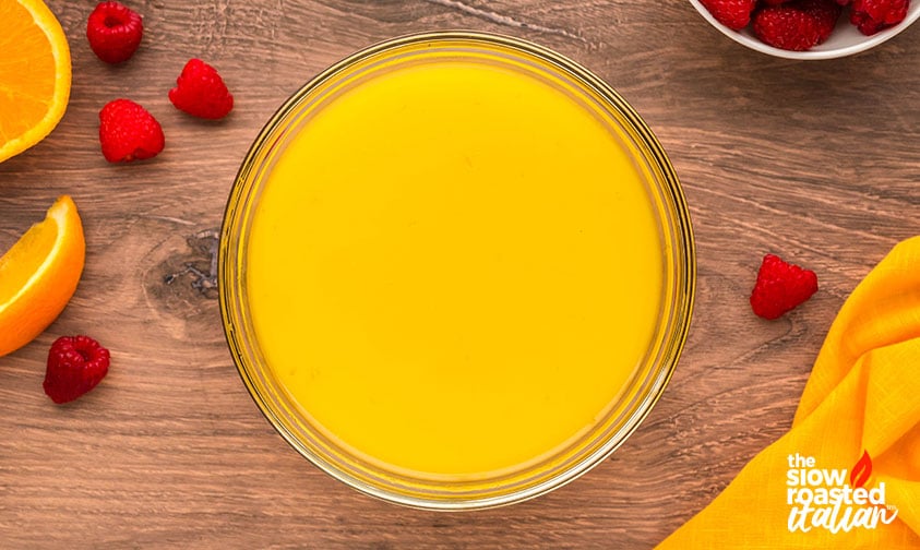 orange juice popsicles mixture in a large mixing bowl