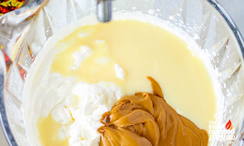 adding peanut butter and condensed milk to reese's peanut butter ice cream mixture
