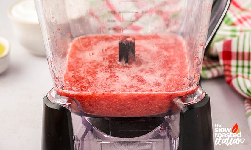 blended strawberries for strawberry yogurt popsicles