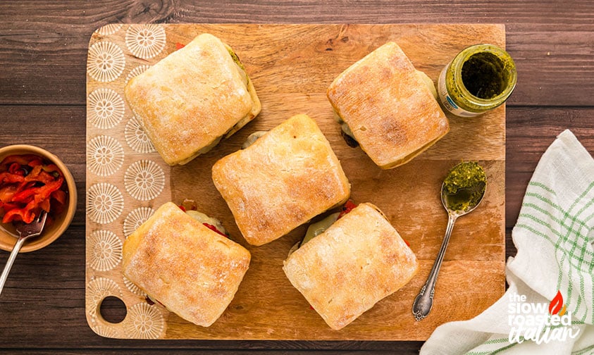 Tuscan Inspired Mediterranean Burgers on a wooden board