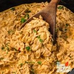 serving Mexican Crack Chicken with a wooden spoon