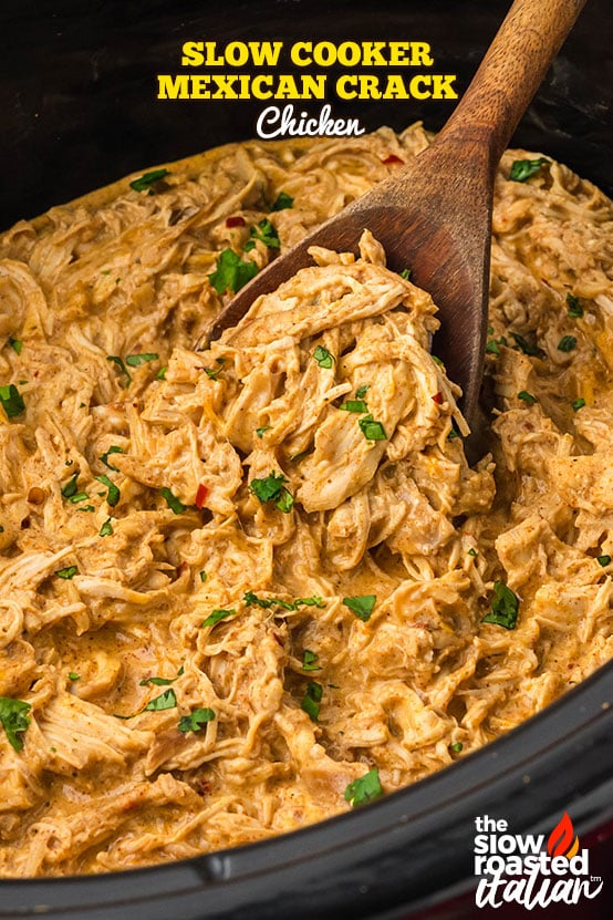 Crockpot Mexican chicken shredded in a creamy cheese sauce with melted Mexican cheese on top